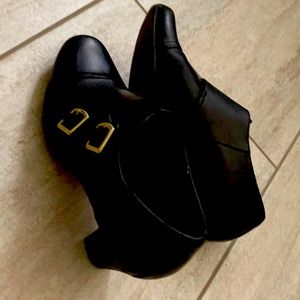 Clark’s black, booties with approximately 2 inch heels